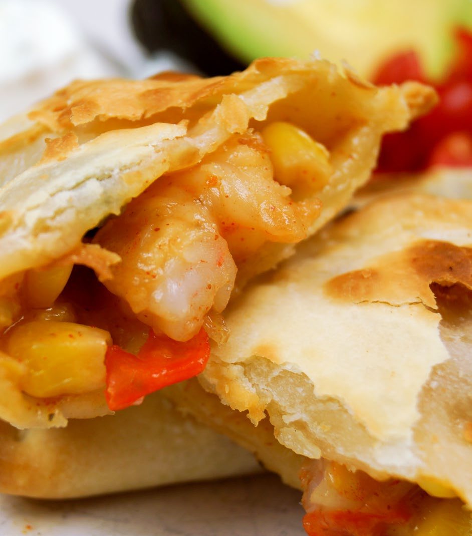 Chicken empanada with salsa and crema